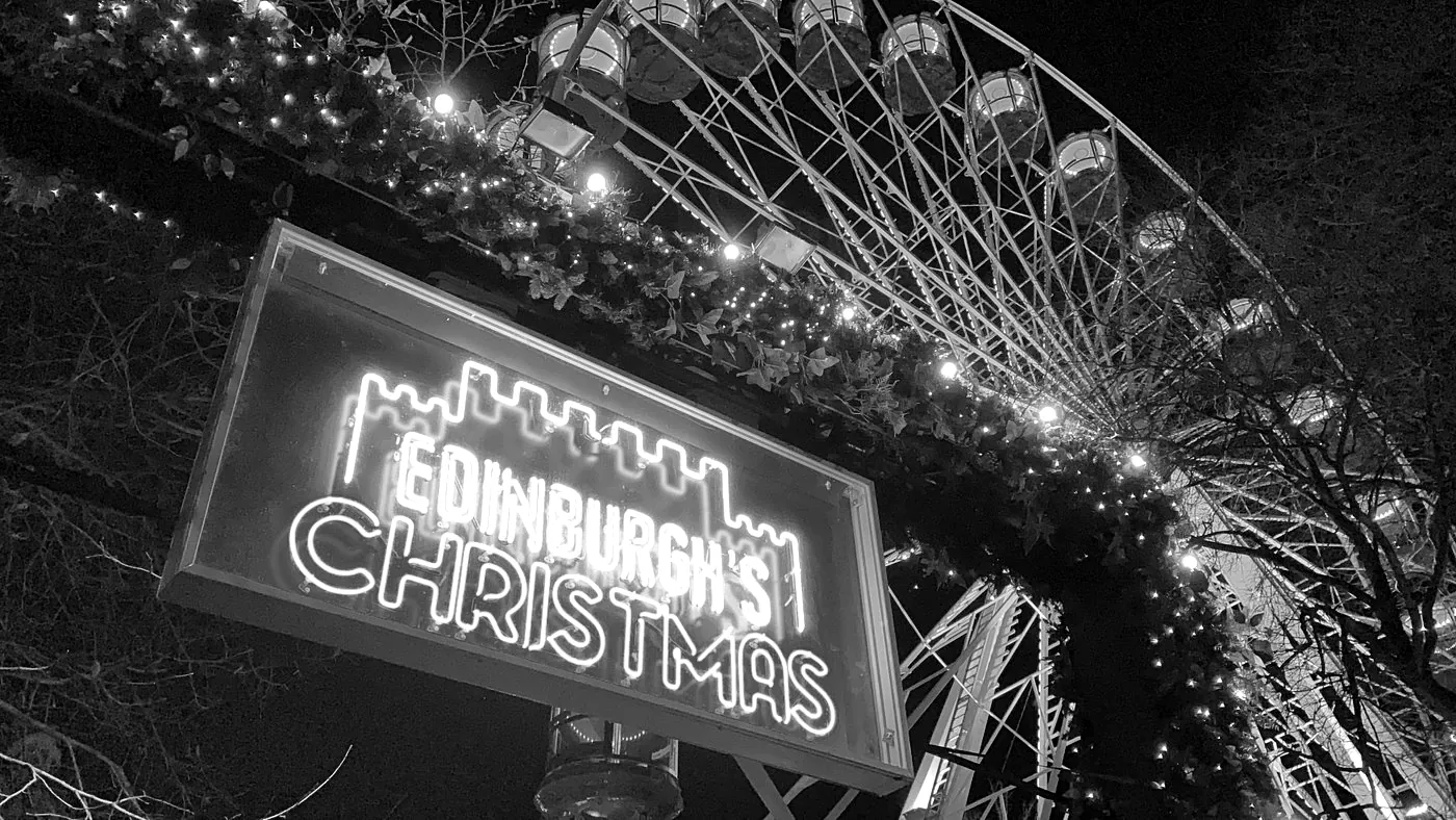 Edinburgh's Christmas neon sign and big wheel at night