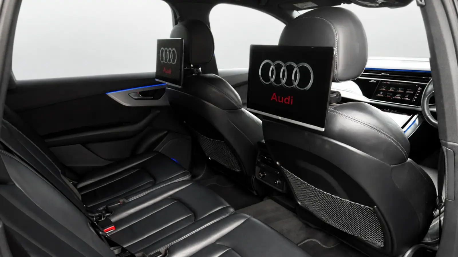 Audi Q7 rear cabin with twin entertainment screens and leather seating