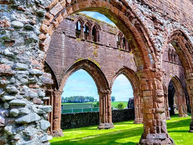 The red sandstone arches of Sweetheart Abbey