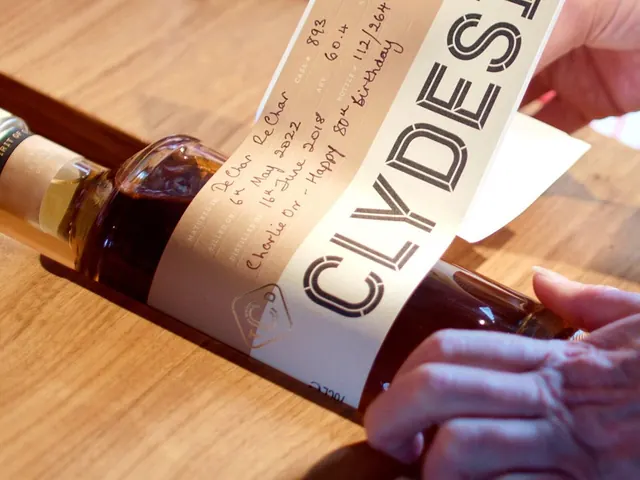 Hand-labelling a bottle at the Clydeside Distillery